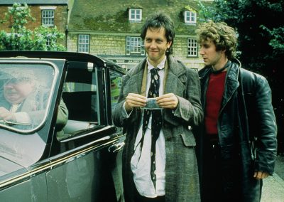 Withnail & I - Withnail and Marwood outside by car